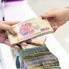 Luật Các tổ chức tín dụng (sửa đổi) khi đi vào cuộc sống sẽ đẩy nhanh tốc độ xử lý nợ xấu của tất cả ngân hàng. Ảnh: Dũng Minh 