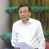 Thứ trưởng Bộ Xây dựng Nguyễn Danh Huy trả lời tại cuộc họp báo - Ảnh TT. 