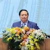 Thủ tướng đề nghị các đại biểu dự hội nghị chia sẻ tư duy, tầm nhìn hành động, góp ý cho Chính phủ những vấn đề còn vướng mắc, những việc chưa làm được với tinh thần doanh nhân là chiến sĩ, "đâu cần, đâu khó có doanh nhân, cùng cả nước biến không thành có, biến khó thành dễ, biến không thể thành có thể". Ảnh: VGP