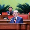 Tổng Bí thư Tô Lâm trình bày báo cáo về các văn kiện tại Đại hội XIV - Ảnh TTXVN .