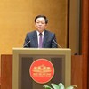 Phó Thủ tướng Chính phủ Hồ Quốc Dũng trình bày trước Quốc hội Báo cáo tiếp thu giải trình dự án Luật sửa đổi, bổ sung một số điều của 10 luật liên quan đến thủ tục hành chính, điều kiện kinh doanh trong lĩnh vực nông nghiệp và môi trường.