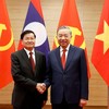 Tổng Bí thư Tô Lâm cùng Tổng Bí thư, Chủ tịch nước Lào Thongloun Sisoulith. Ảnh: Đức Thanh