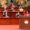 Ủy viên Bộ Chính trị, Bí thư Trung ương Đảng, Chủ tịch UBTƯ MTTQ Việt Nam Bùi Thị Minh Hoài và các đại biểu tiến hành biểu quyết tại Đại hội. Ảnh: Quang Vinh.