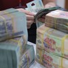 Việc nâng trần tỷ lệ vốn ngắn hạn cho vay trung dài hạn sẽ giảm bớt áp lực huy động vốn dài hạn cho các ngân hàng 