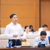 Thống đốc Ngân hàng Nhà nước Phạm Đức Ấn trình bày tờ trình dự án luật. 