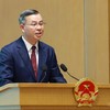 Bộ trưởng Bộ Tài chính Ngô Văn Tuấn trình bày Báo cáo trung tâm của Hội nghị - Ảnh: VGP