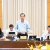 Chủ nhiệm Ủy ban Kinh tế và Tài chính Phan Văn Mãi trình bày báo cáo thẩm tra - Ảnh: QH 