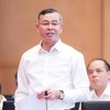 Bộ trưởng Bộ Tài chính Ngô Văn Tuấn hồi âm các vấn đề được đại biểu quan tâm - Ảnh: QH. 