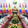 Thủ tướng Lê Minh Hưng và Thủ tướng Lào Saleumxay Kommasith hội đàm. (Ảnh: Dương Giang/TTXVN)