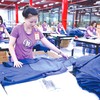 Doanh nghiệp dệt may tăng tốc sản xuất để đáp ứng đơn hàng cuối năm (Ảnh: Lê Toàn)