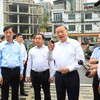 Tổng Bí thư, Chủ tịch nước Tô Lâm và các đồng chí lãnh đạo Trung ương, TP. Hà Nội kiểm tra tiến độ thực hiện Dự án đường Vành đai 1 và Dự án bãi đỗ xe, cây xanh trên địa bàn phường Ô Chợ Dừa. Ảnh Quang Thái