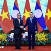 Thủ tướng Lê Minh Hưng tiếp đồng chí Vilay Lakhamfong, Thường trực Ban Bí thư Trung ương Đảng Nhân dân Cách mạng Lào. (Ảnh: Dương Giang/TTXVN)