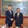 Thường trực Ban Bí thư Trần Cẩm Tú và Ủy viên Trung ương Đảng, Bí thư Trung ương Đoàn Thanh niên Nhân dân Cách mạng Lào Thongly Sisoulith. (Ảnh: Phương Hoa/TTXVN)