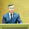 Bộ trưởng Bộ Tài chính Ngô Văn Tuấn trình Quốc hội dự án luật - Ảnh: Đức Thanh.