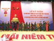 Đại tướng Phùng Quang Thanh - Ủy viên Bộ Chính trị, Phó Bí thư Quân ủy Trung ương, Bộ trưởng Bộ Quốc phòng gắn Huân chương Lao động hạng Nhất lên Quân kỳ Quyết thắng