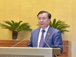 Bộ trưởng Bộ Tài chính Đinh Tiến Dũng trình bày Tờ trình