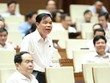 Bộ trưởng Bộ Nông nghiệp và Phát triển nông thôn Nguyễn Xuân Cường phát biểu tại nghị trường.