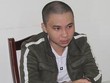 Nguyễn Đức Huy tại cơ quan công an.