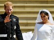 Hoàng tử Harry và vợ Meghan Markle trong hôn lễ ngày 19/5. Ảnh: AFP.