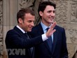 Tổng thống Pháp Emmanuel Macron (ảnh, trái) cam kết sẽ thảo luận thẳng thắn và hiệu quả với Tổng thống Donald Trump tại G7. (Nguồn: EPA/TTXVN).