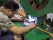 Công nhân làm việc trong một nhà máy ở Quảng Châu (Trung Quốc). Ảnh: Bloomberg.