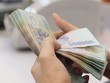 Bị gán 'thao túng tiền tệ' là rủi ro lớn, buộc Ngân hàng Nhà nước phải thận trọng khi muốn giảm giá VND.
