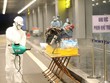 Phun hóa chất khử trùng hành lý của cho công dân Việt Nam trở về từ Vũ Hán (Trung Quốc). (Ảnh: Dương Giang/TTXVN).