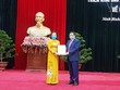 Ông Phạm Minh Chính, Trưởng Ban tổ chức Trung ương trao quyết định điều động, phân công bà Nguyễn Thị Thanh giữ chức Phó trưởng Ban tổ chức Trung ương.
