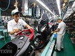 Dây chuyền lắp ráp xe gắn máy tại Công ty TNHH Honda Việt Nam, vốn đầu tư của Nhật Bản tại Vĩnh Phúc. (Ảnh: Danh Lam/TTXVN).