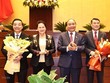 Chủ tịch Quốc hội Nguyễn Thị Kim Ngân và Thủ tướng Nguyễn Xuân Phúc tặng hoa chúc mừng ông Chu Ngọc Anh và ông Lê Minh Hưng đã hoàn thành nhiệm vụ Quốc hội giao và chuyển sang đảm nhiệm vị trí công tác mới. (Ảnh: Trọng Đức/TTXVN).