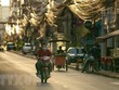 Người dân đeo khẩu trang phòng dịch COVID-19 tại Vientiane, Lào. (Nguồn: THX/TTXVN).