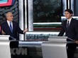 Thủ tướng Canada, lãnh đạo đảng Tự do, Justin Trudeau (phải) và lãnh đạo đảng Bảo thủ Erin O'Toole trong cuộc tranh luận tại Gatineau, Quebec, Canada. (Ảnh: AFP/TTXVN)