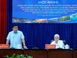 Bộ trưởng Bộ Kế hoạch và Đầu tư Nguyễn Chí Dũng (bìa trái) làm việc với Tỉnh ủy Bình Dương. (Ảnh: MPI).