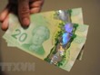 Đồng đôla Canada. (Ảnh: AFP/TTXVN)