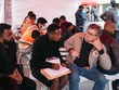 Người nhập cư đăng ký thủ tục tại một trại tị nạn Pháp. Ảnh: Le Monde.