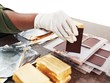 Sản xuất vàng miếng và các vật phẩm lưu niệm bằng vàng là một trong những lĩnh vực mà NHNN sẽ giữ 100% vốn