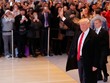 Donald Trump chào đám đông tập trung ở sảnh tòa nhà củaNew York Times ngày 22/11. Ảnh: Reuters