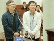 Bị cáo Đinh Mạnh Thắng (áo khoác sẫm màu) đối chất với bị cáo Trịnh Xuân Thanh. Ảnh: VietnamPlus