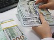 Nhiều tập đoàn đa quốc gia muốn Ngân hàng Nhà nước bỏ trần lãi suất huy động USD đang ở mức 0%.