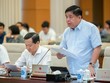 Bộ trưởng Bộ Kế hoạch và Đầu tư Nguyễn Chí Dũng báo cáo tại phiên họp.