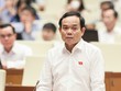 Phó thủ tướng Trần Lưu Quang báo cáo trước Quốc hội, sáng 7/6