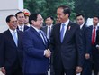 Thủ tướng Chính phủ Phạm Minh Chính đón Tổng thống Indonesia Joko Widodo. (Ảnh: VGP/Nhật Bắc)