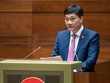 Chủ nhiệm Ủy ban Kinh tế Vũ Hồng Thanh trình bày báo cáo thẩm tra.