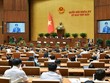 Quốc hội nghe Chủ nhiệm Uỷ ban Kinh tế Vũ Hồng Thanh báo cáo thẩm tra.