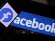 Biểu tượng của Facebook trên màn hình điện thoại thông minh. Ảnh: AFP/TTXVN
