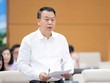 Thứ trưởng Bộ Tài chính Nguyễn Đức Chi trình bày báo cáo. 