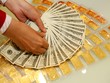 Vàng tiếp tục giảm, USD tiếp tục tăng