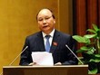 Phó thủ tướng Nguyễn Xuân Phúc thay mặt Chính phủ đã trình bày Báo cáo tổng hợp việc thực hiện các nghị quyết của Quốc hội