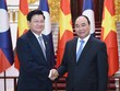 Thủ tướng Nguyễn Xuân Phúc hội đàm với Thủ tướng Lào Thoonglun Sisulith (Ảnh: VGP/Quang Hiếu)