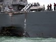 Lỗ thủng trên vỏ tàu USS John S. McCain. Ảnh: Reuters.